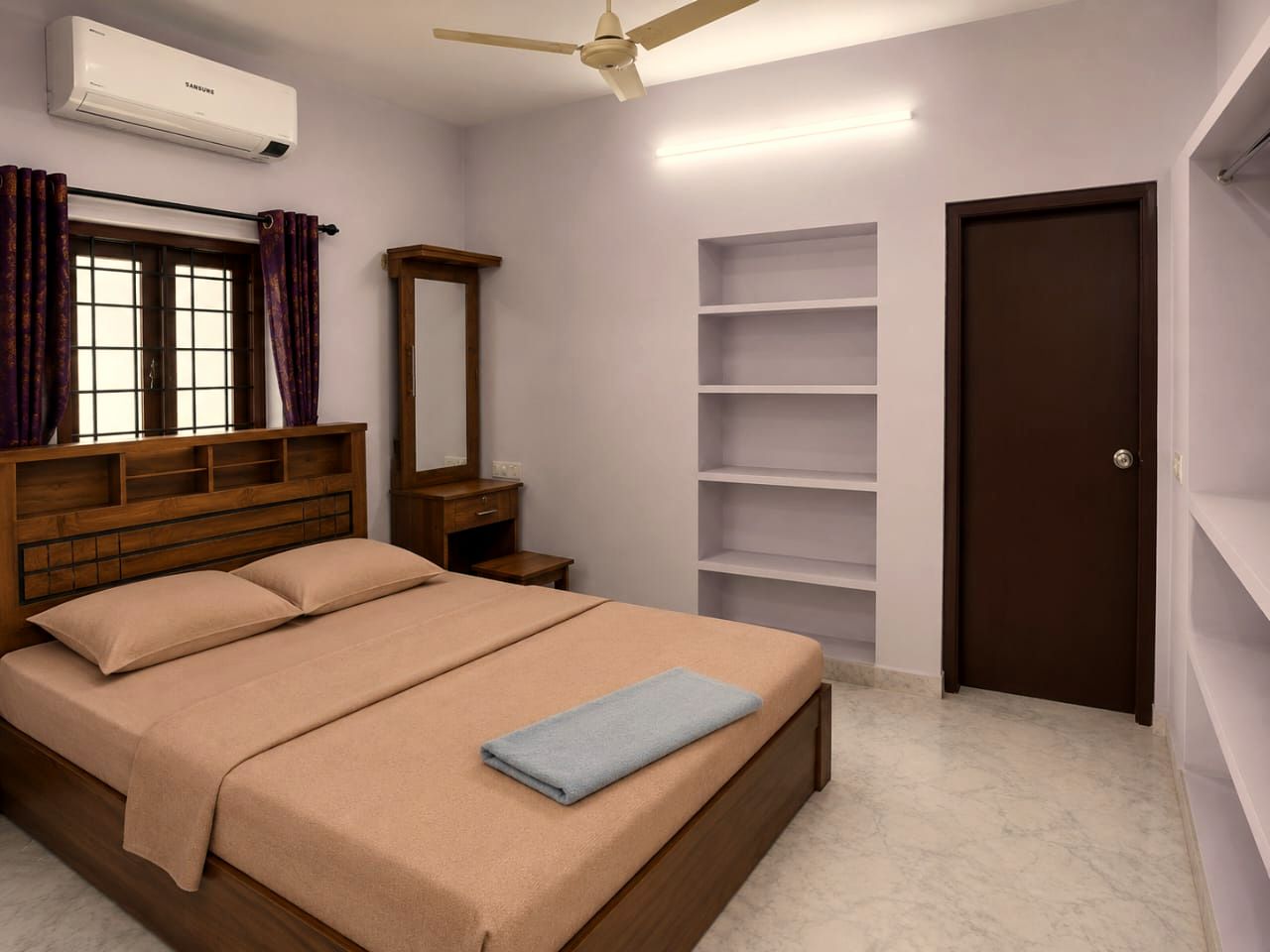 Air-conditioned bedroom suite with wooden bed at VanThara villa, Turkayamjal