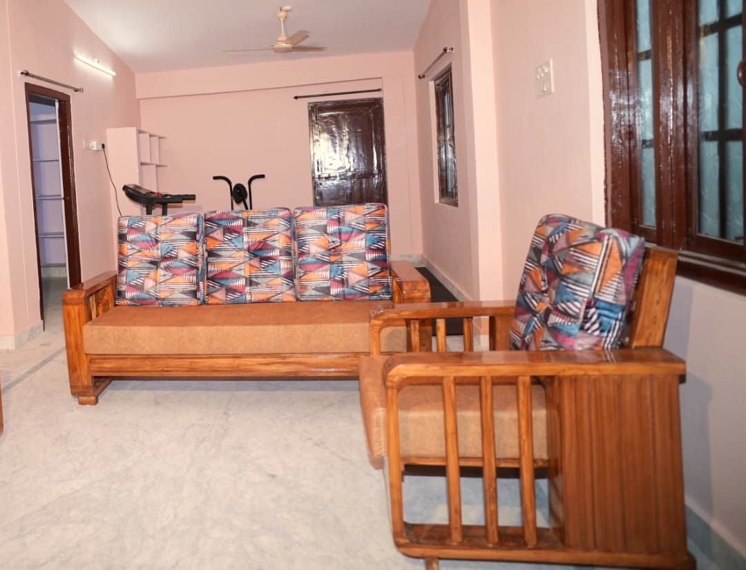 Teak-wood upstairs family lounge at VanThara villa, Turkayamjal