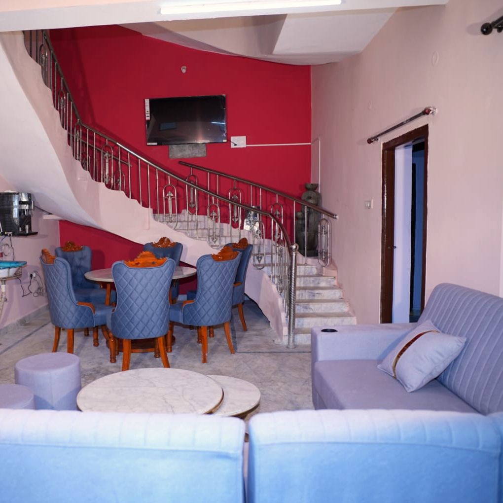 Curved staircase and family dining area at VanThara villa, Turkayamjal